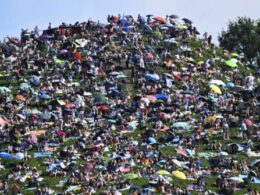 Fans swarm hill in Munich, claiming a high perch for watching Taylor Swift concert for free