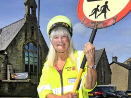 Meet the UK’s longest-serving lollipop lady, 84, who is still helping kids cross the road after 55 years