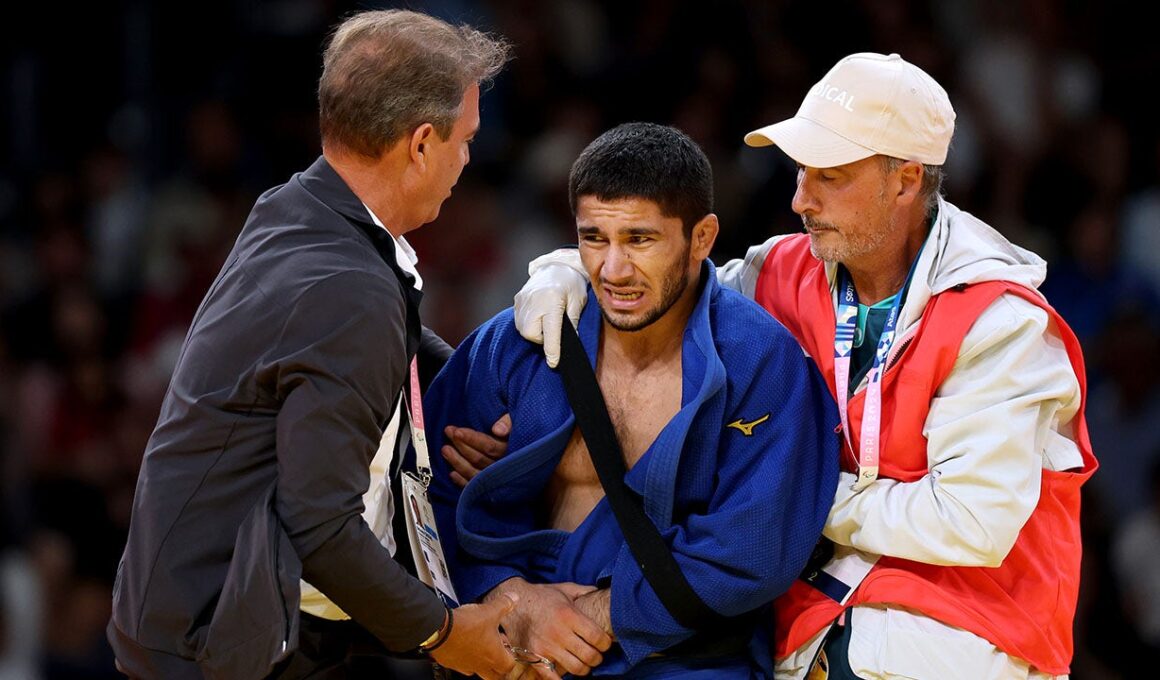 Tajikistani judoka refuses to shake hands with Israeli opponent at Paris Olympics, later withdraws over injury