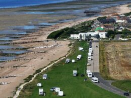 Binbags, gas canisters and old pots and pans are left behind by travellers moved on from beach