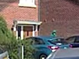 Chilling moment hooded and masked figure paces outside house 20 minutes before two children were stabbed to death at Taylor Swift-themed dance workshop – as footage shows armed police preparing to raid the same property hours later