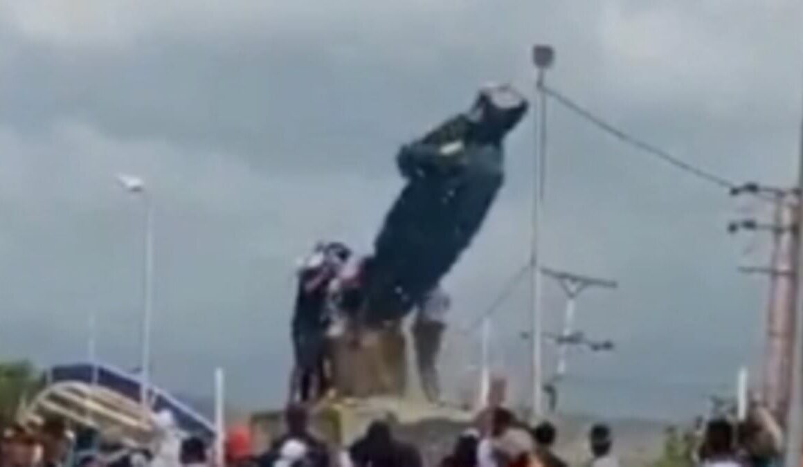 Venezuelan activists topple Hugo Chavez statue amid violence over the country’s disputed presidential election