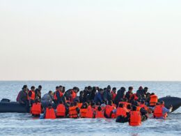 English Channel migrant crossings hit record high, figures show – as one person about to embark on the dangerous journey shouts: ‘This is for Rishi Sunak’ after Labour axed his Rwanda plan