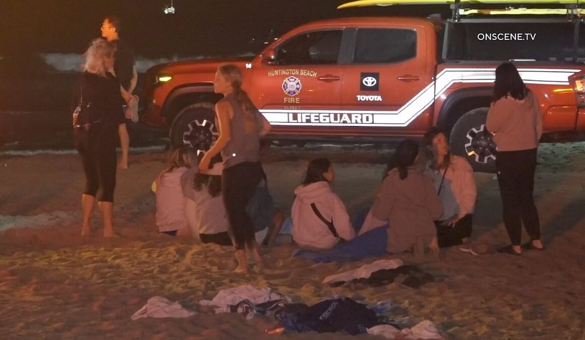 Stricken children sob on California beach after boy, 15, went for night time swim off pier and vanished