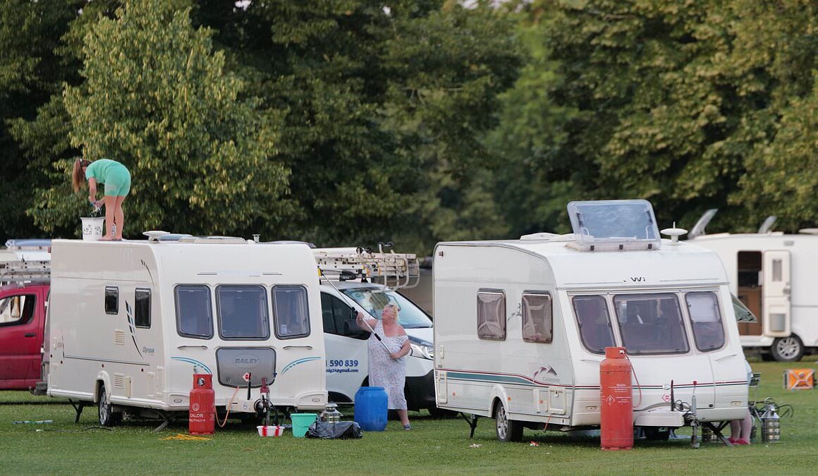 Travellers pitch up with 35 caravans on common near Richmond as they ‘leave rubbish on the green and dump inflatable toys in the pond’