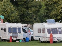 Travellers pitch up with 35 caravans on common near Richmond as they ‘leave rubbish on the green and dump inflatable toys in the pond’