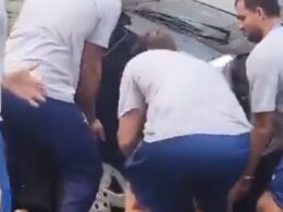 Hilarious moment Greek Olympic water polo team lift badly parked car so their bus can squeeze down narrow Paris street