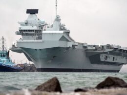 Britain’s ‘cursed’ state-of-the-art £3.5billion aircraft carrier HMS Queen Elizabeth arrives back in Portsmouth after repairs that left her in a dry dock for months