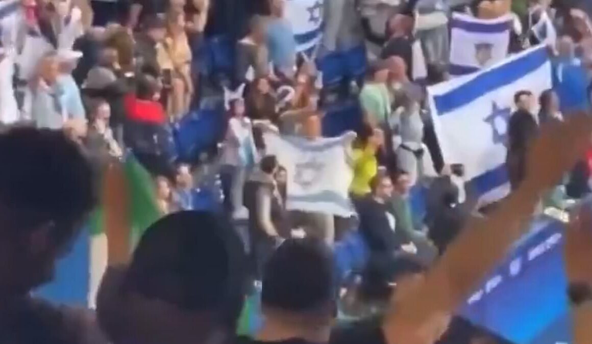 Shocking moment pro-Palestine yobs scream ‘Heil Hitler’ and make Nazi salutes during Israel’s Olympic football match