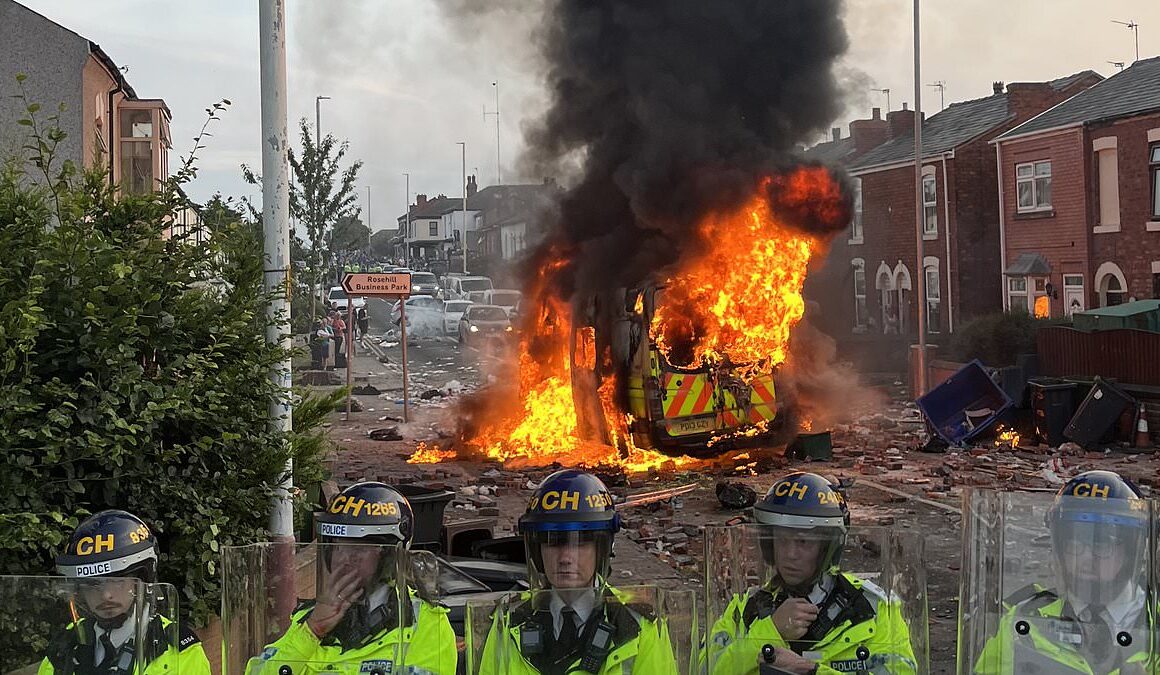 Shocking moment anti-Muslim mob burn police van outside mosque in Southport and chant ‘English till I die’  near where three girls were killed in knife attack