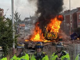 Shocking moment anti-Muslim mob burn police van outside mosque in Southport and chant ‘English till I die’  near where three girls were killed in knife attack