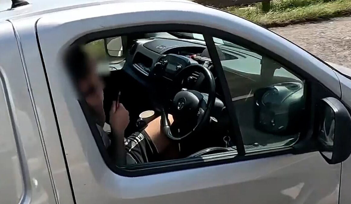 Shocking moment motorway driver is caught on camera trimming his beard behind the wheel – as police catch 240 motorists risking life on the network