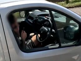 Shocking moment motorway driver is caught on camera trimming his beard behind the wheel – as police catch 240 motorists risking life on the network