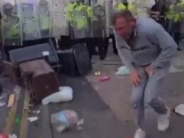 EXCLUSIVERevealed: Southport rioter who gyrated suggestively to goad police before being hit by two bricks is a ‘party animal’ 39-year-old father-of-two