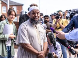 ‘Terrified’ imam trapped in Southport mosque for hours as rioters attacked said he feared they would ‘burn the place down’ with him inside – as he praises ‘humbling’ response from locals who repaired damage and brought flowers today