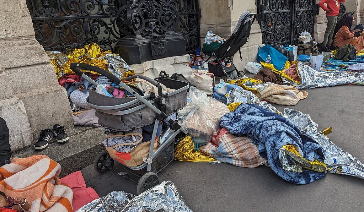 Homeless people protest at Paris city hall demanding a solution to the city’s housing crisis on the eve of the 2024 Olympic Games