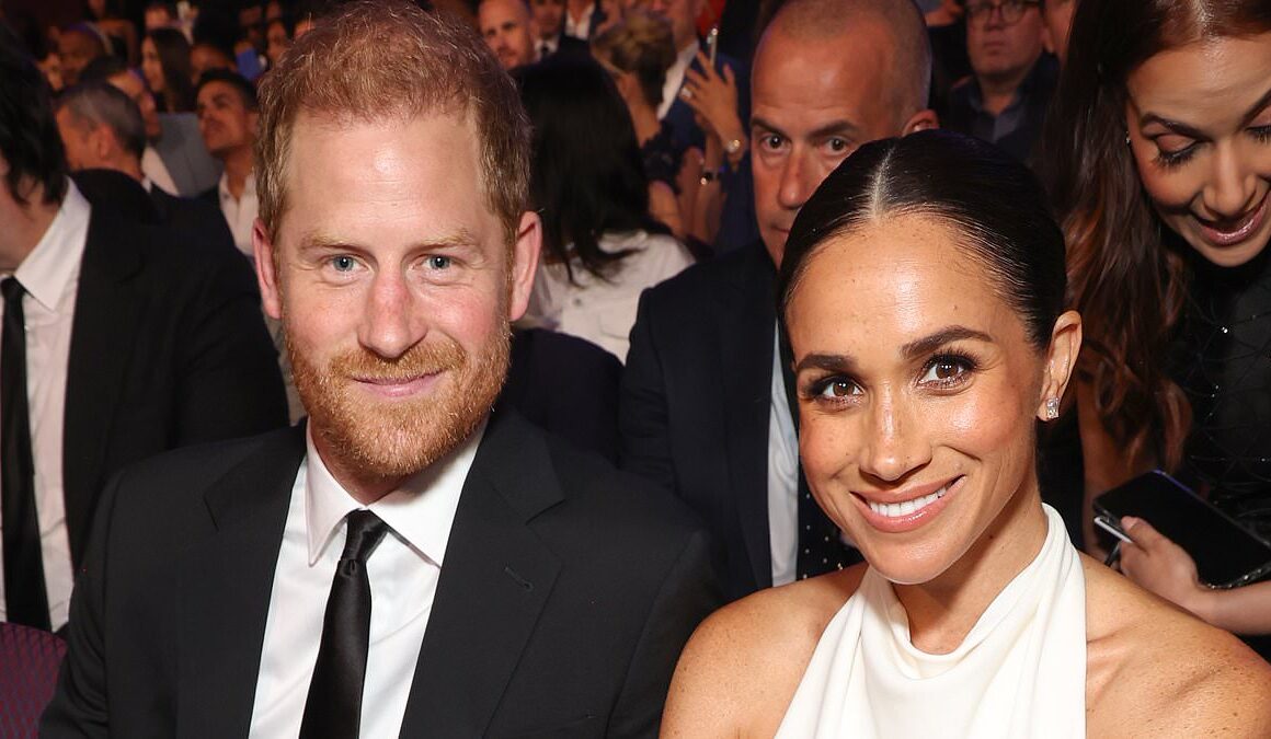 Meghan Markle unlikely to join Prince Harry for ‘olive branch trip’ to reconnect with his family because she has ‘too much on her plate’ and ‘fears being heckled in public’, magazine reports