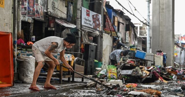 ‘Back to zero’: Manila flood victims clean up, start again