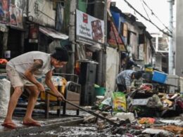 ‘Back to zero’: Manila flood victims clean up, start again