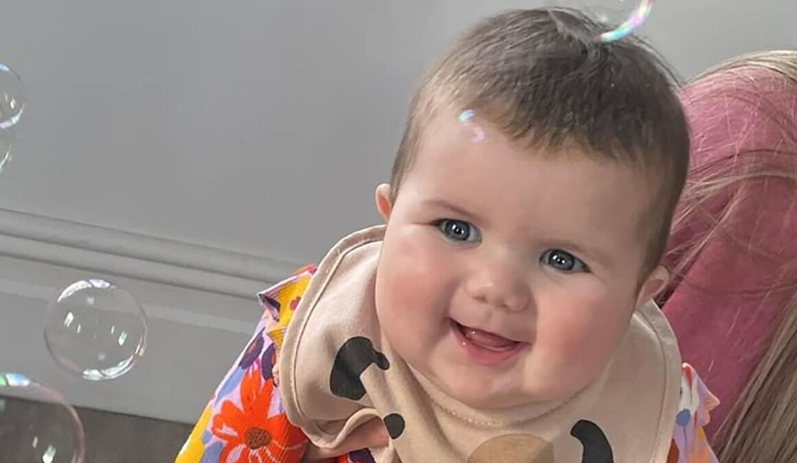 Elderly driver, 70, is charged after baby girl died when her pushchair was hit by a car outside hospital in horror crash that injured two others