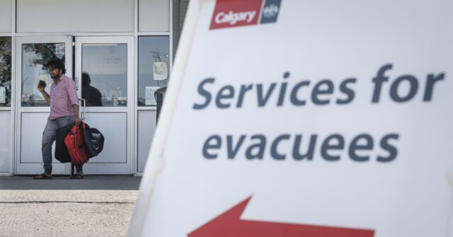 Fast-moving wildfire in the Canadian Rockies ravages the picturesque resort town of Jasper