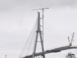 Workers link US, Canadian sides of new Gordie Howe International Bridge over Detroit River