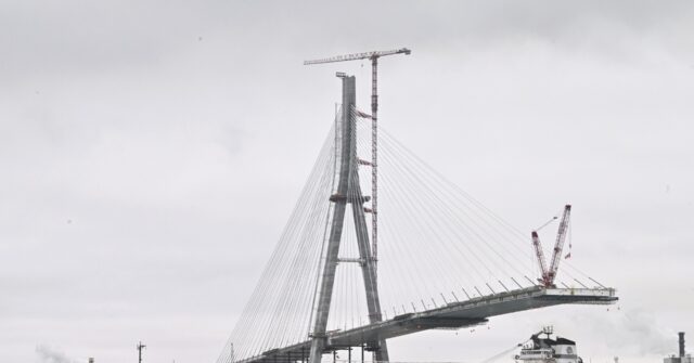 Workers link US, Canadian sides of new Gordie Howe International Bridge over Detroit River