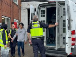 Home Office raids scrapyard to find illegal immigrants living in makeshift shipping containers as they earn just £2.33 an hour for 60-hour weeks