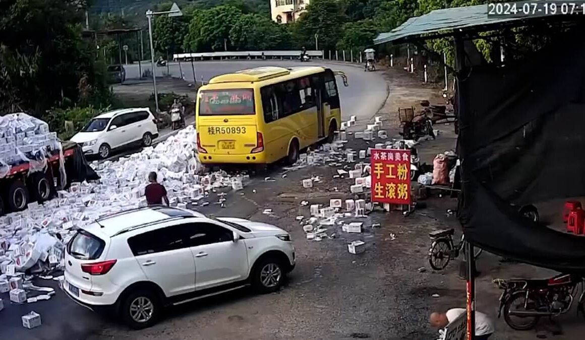 Look out – BEER avalanche! Hilarious moment road is overrun with lager after truck driver takes a corner too quickly