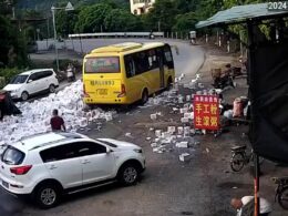 Look out – BEER avalanche! Hilarious moment road is overrun with lager after truck driver takes a corner too quickly