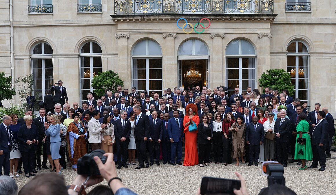 France’s 5ft 7in president is nearly impossible to see as he poses alongside world leaders in Paris for the Olympic Games