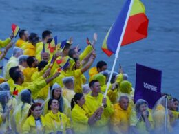 Olympic moment of the day: Married couple makes history as Romania’s flag bearers