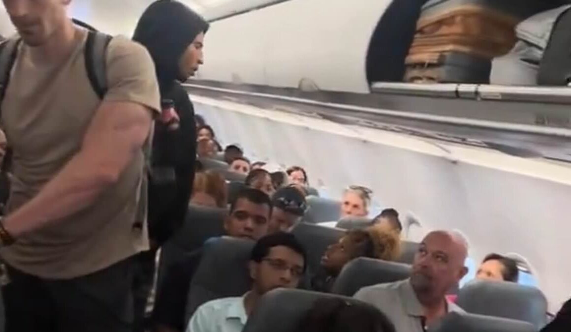 Ugly spat breaks out aboard Frontier Airlines flight to Atlanta as man and woman taunt each other for bizarre reason: ‘Show me a band!’