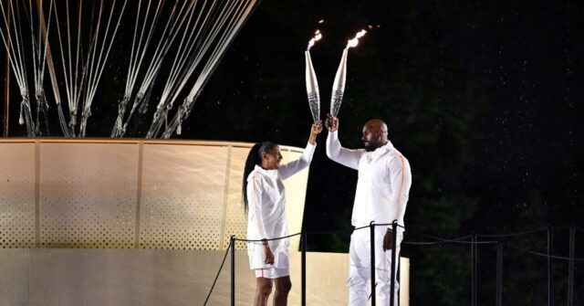 Perec follows idol Ali in lighting Olympic cauldron