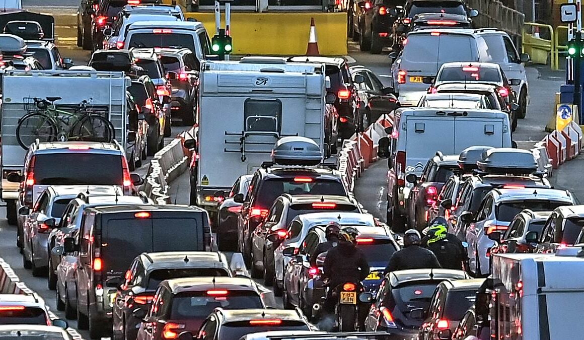 Stay at home! Queues build at Dover, 3.6million cars hit the road and Eurostars are still axed as families are urged to rethink their plans on busiest travel day of the year