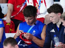 Tom Daley gets his KNITTING out at the Olympics: Diving star knits one, pearls two as he works on woolly jumper while watching women’s event