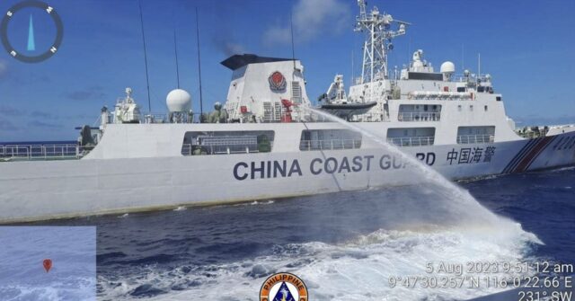 Philippine forces sail to hotly disputed shoal without incident for first time since deal with China