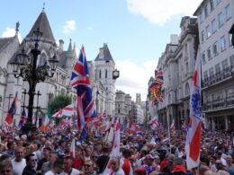 Thousands fill central London for Tommy Robinson rally amid chants of ‘We want our country back’ as Met police flood streets with 1,000 officers to keep the peace as capital with anti-racism counter-protest and Trans Pride event also due