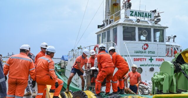 Philippine coast guard says oil leaking from sunken tanker