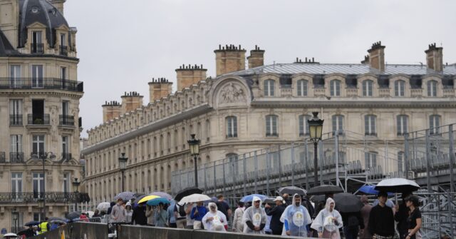 Paris barricades start to come down after opening ceremony on the Seine, but many still struggling