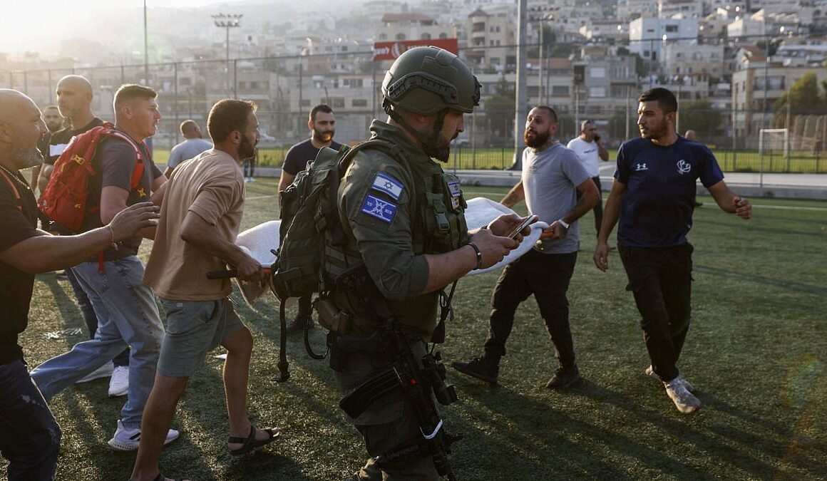 Rocket attack blamed on Hezbollah ‘kills at least 11 children and teenagers’ on football field at Israeli-controlled Golan Heights – hours after airstrike which targeted members of the Lebanese militant group