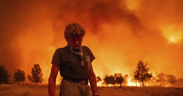 Firefighters helped by cooler weather battle blaze that has scorched area size of Los Angeles