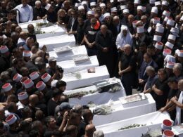 Thousands of mourners gather for funerals of children after ‘at least 12’ killed by Hezbollah rocket attack on football field at Israeli-controlled Golan Heights – as IDF chief vows ‘very significant reaction’ to onslaught