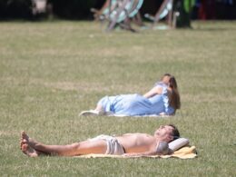 Britain bakes: Brits take a dip in the sea and sunbathe in parks as heatwave grips the UK – with temperatures set to eclipse hottest day of the year so far