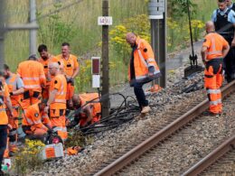 Far-left group claim responsibility for Paris arson attacks that crippled country’s rail network just hours before Olympic opening ceremony