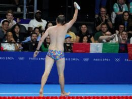 Olympic moment of the day: Cap-catching lifeguard steals the swimming show