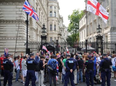 Flag-waving Tommy Robinson protesters chant ‘release Tommy now’ outside Downing Street after ‘arrest under anti-terror laws’