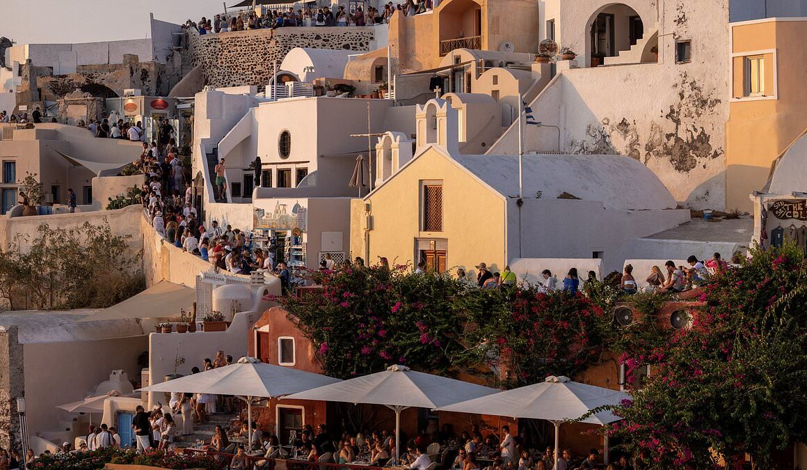 Locals’ fury as Santorini council tells them to stay ‘locked away’ at home so ‘tourists can wander free’ on their tiny Greek island – as record number of 17,000 tourists descend in ONE day