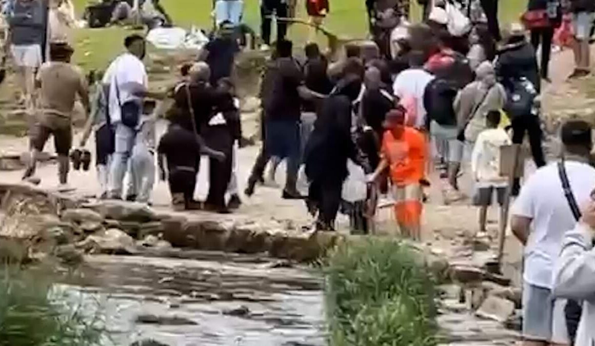 Moment huge brawl erupts at Dovedale stepping stones beauty spot as people hurl large sticks at each other