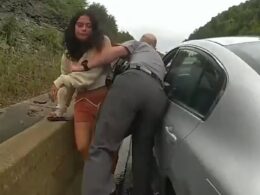 Infuriating moment entitled woman lashes out at cops for taking her phone as she’s finally caught after leading officers on dramatic 110mph chase